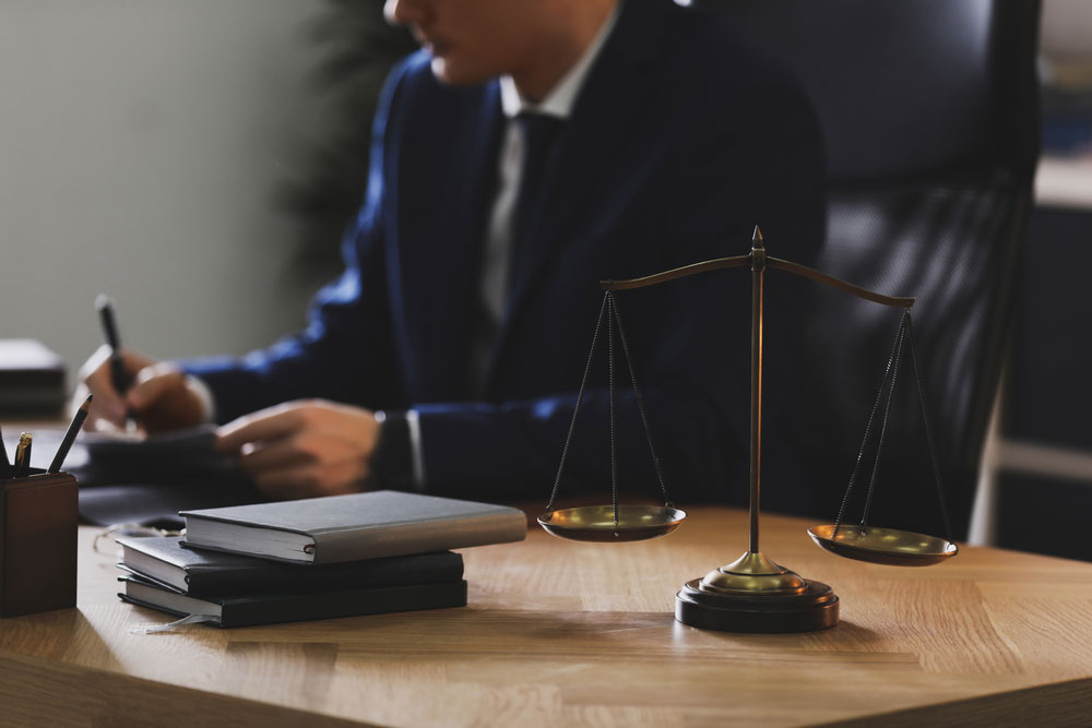 Attorney desk with scales of justice